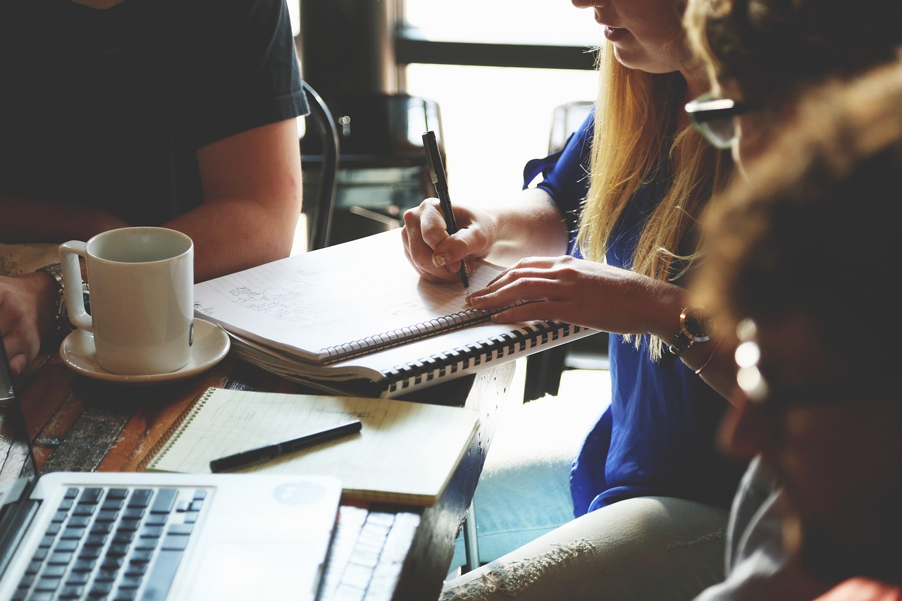 financial advisor reviewing transition documents with legal counsel