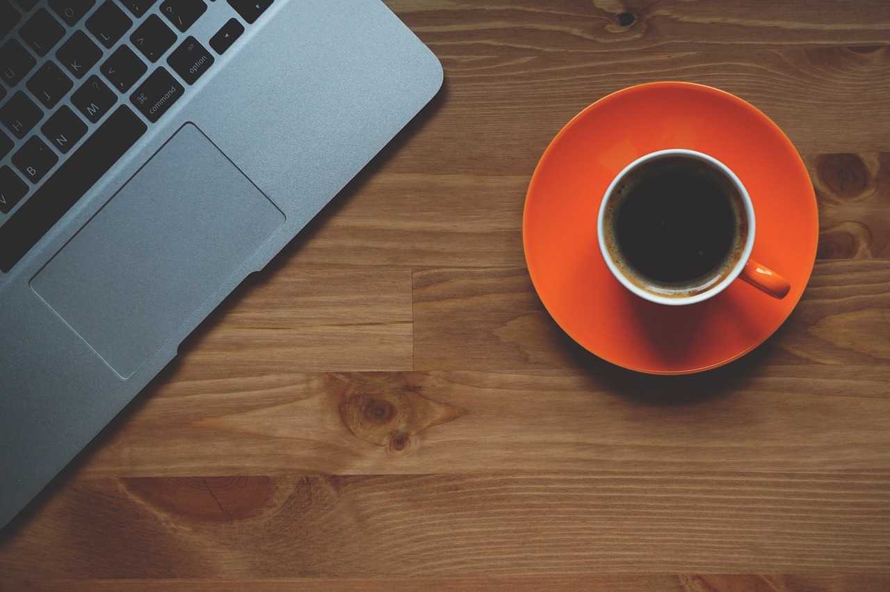 financial advisor reviewing transition documents and strategy notes with a coffee cup