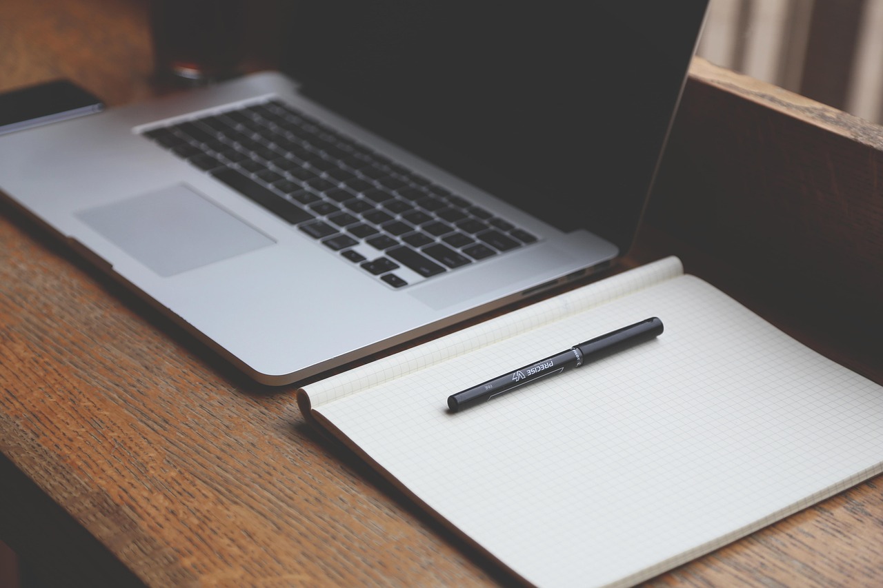financial advisor reviewing client correspondence at a desk